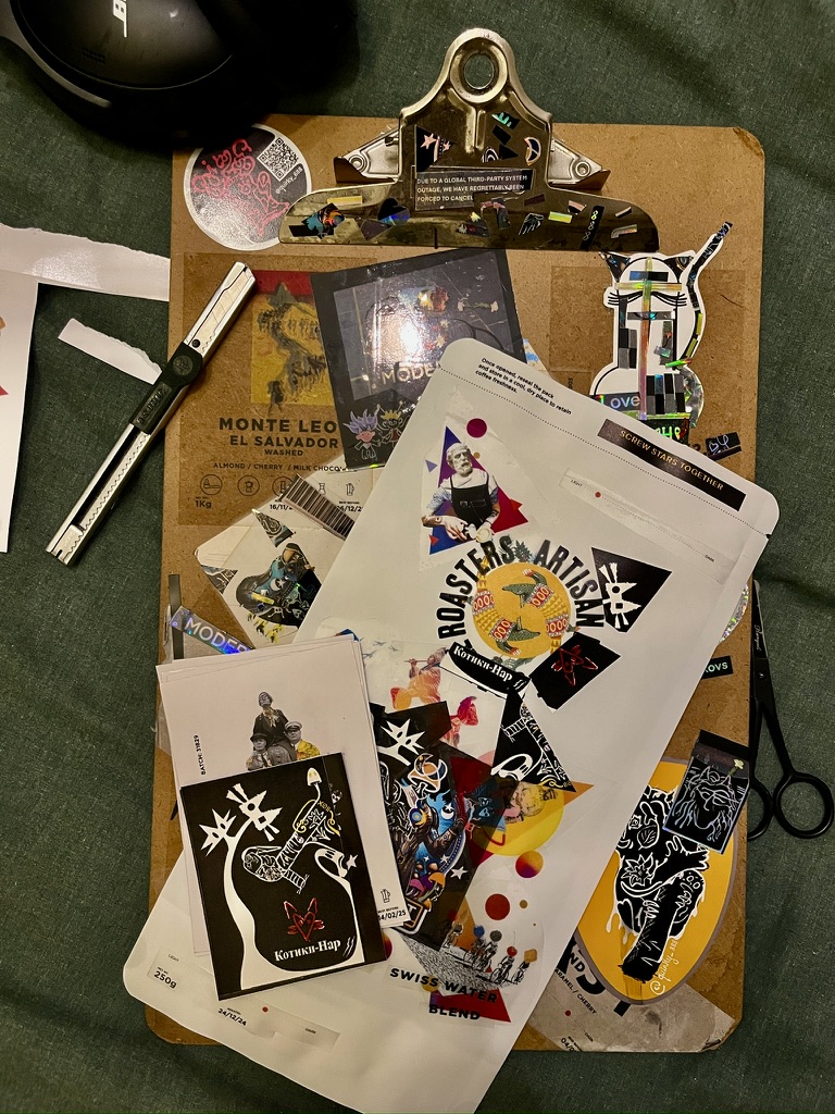 Alternating views of Q-Bag V0 being made at home on a working table and standing among the artist's other work